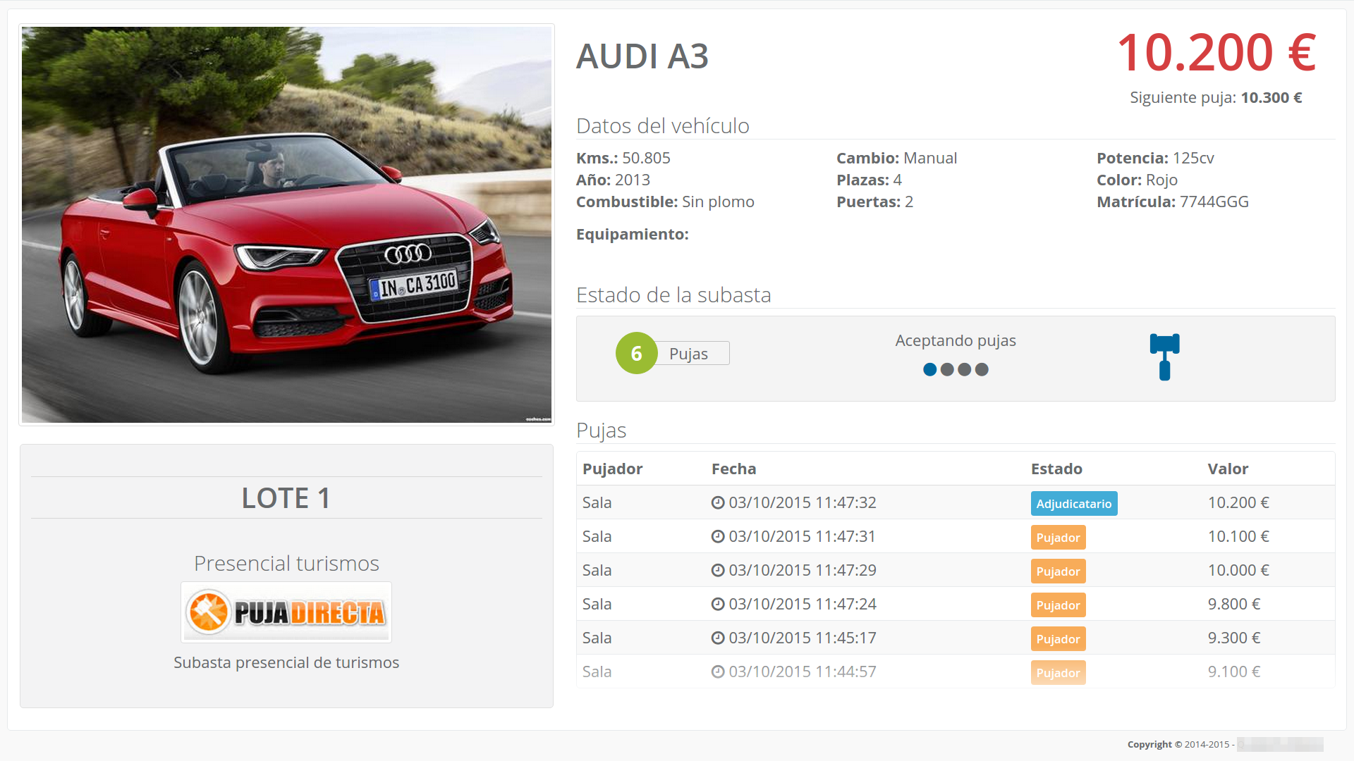 Large venue display screen showing live auction information